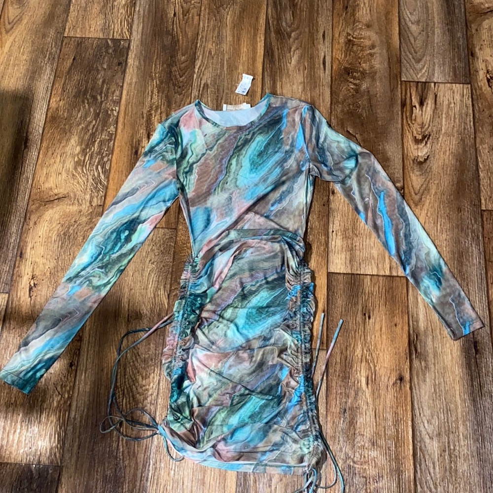 A long sleeve mesh type dress